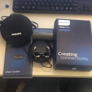 Philips hearlink hearing aids with charger.  Hearing aids are brand new
